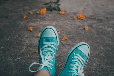 A pair of turquoise high help sports shoes
